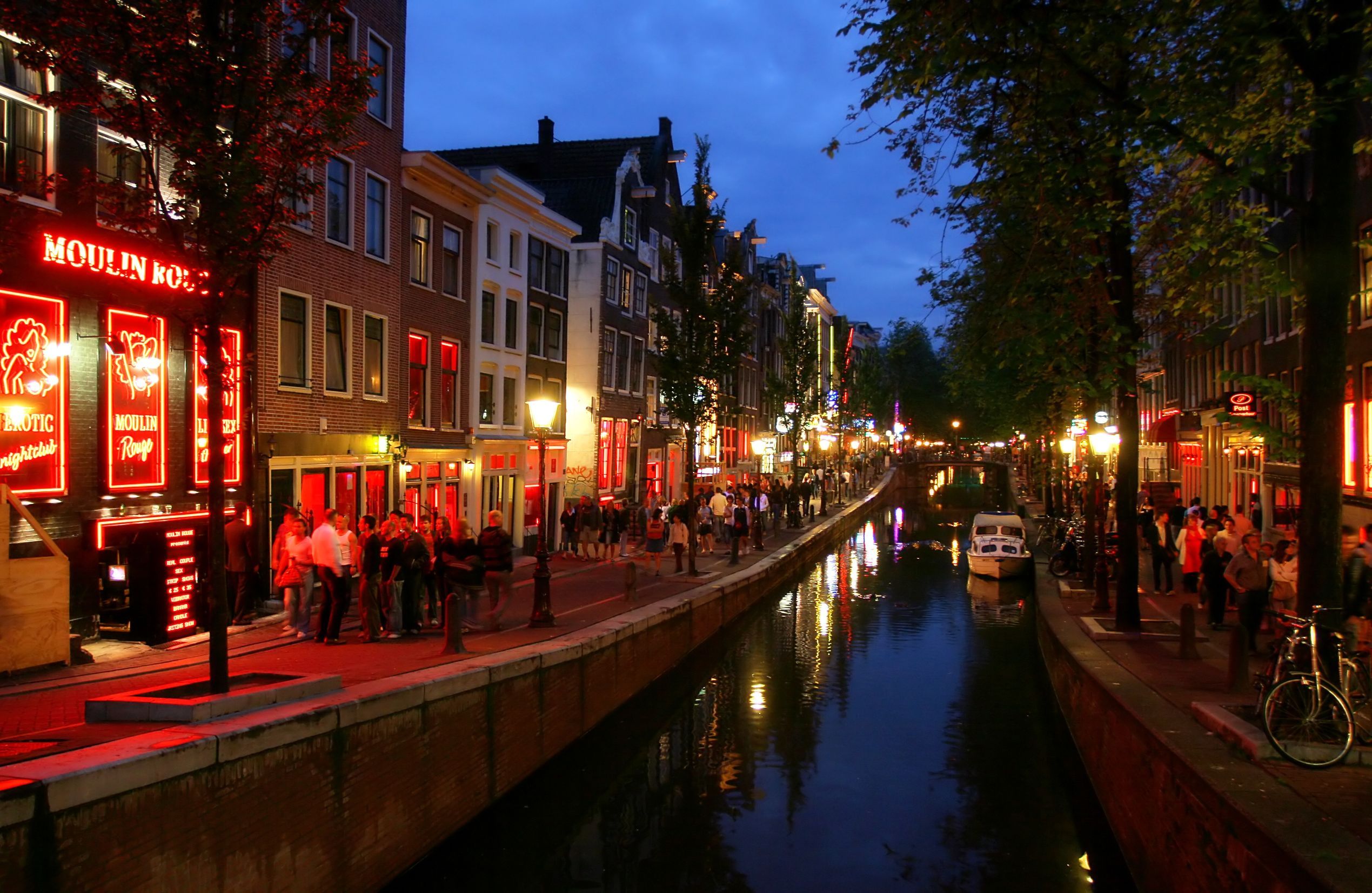 http://www.layoverguide.com/wp-content/uploads/2011/12/Red-Light-District-at-evening-in-Amsterdam-Holland.jpg