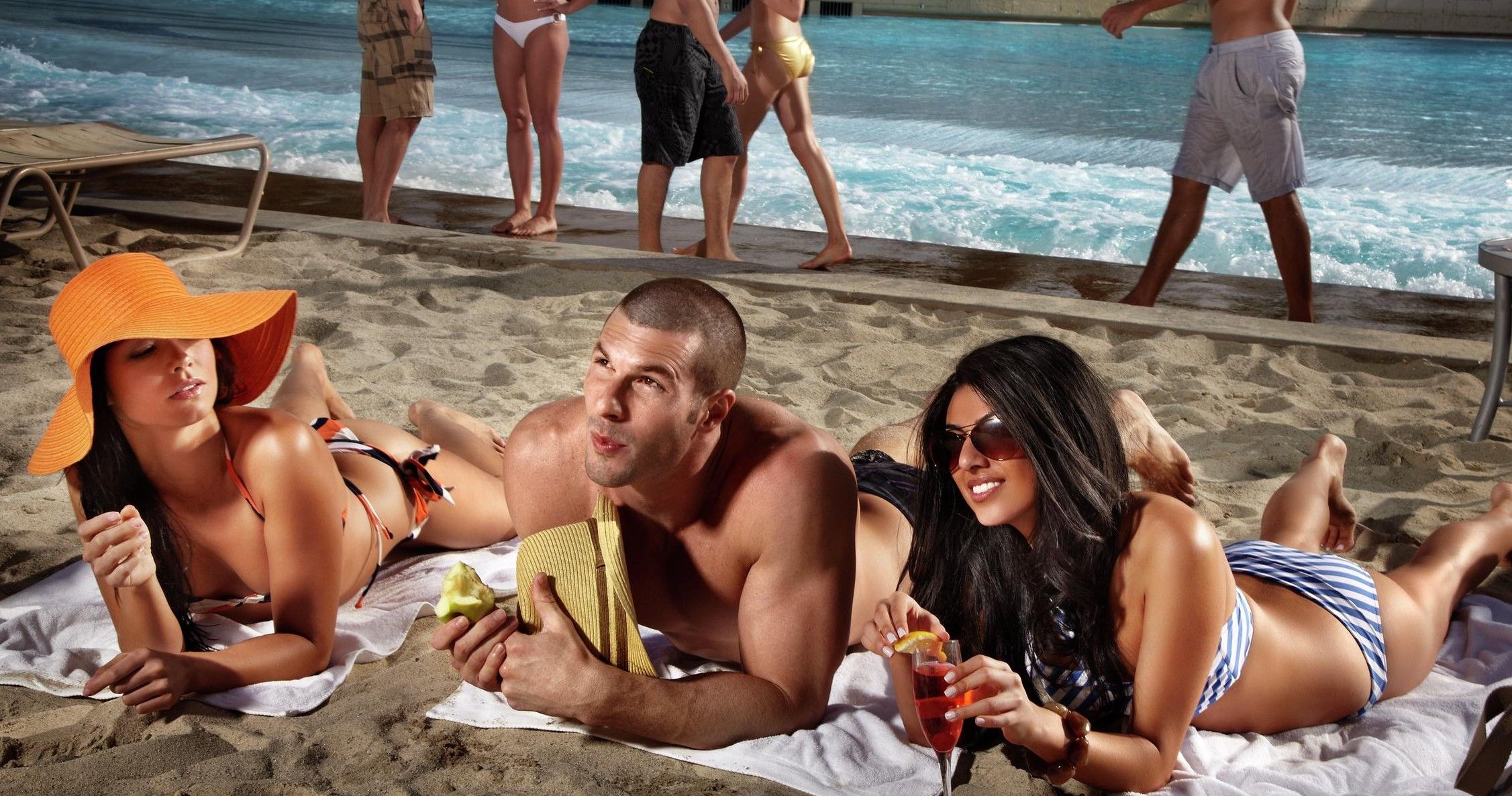 girl and two guys at the beach