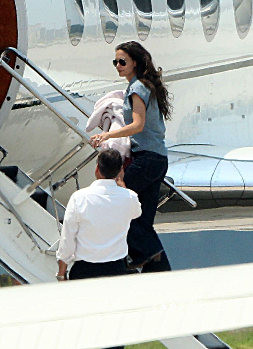A Picture Of Katie Holmes And Her Child Boading Her Gulfstream Jet